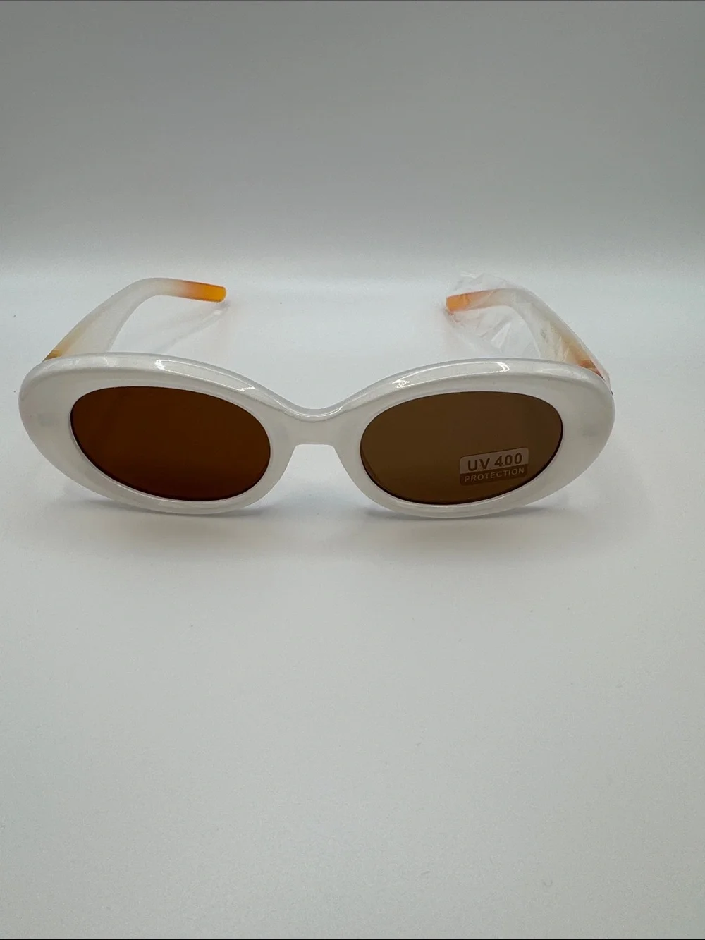 White Oval Sunglasses with Brown Lenses